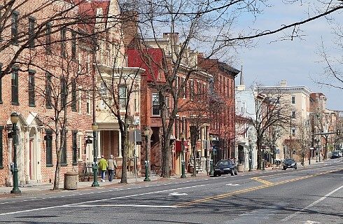 Outdoor view overlooking a downtown main street with a variety of different storefronts and businesses